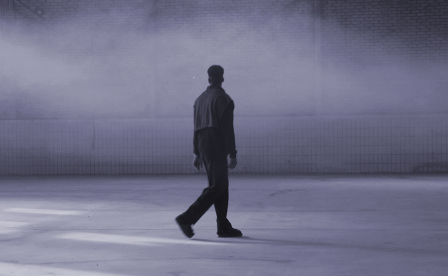 Thumbnail Stories2Tell: A person walks through a warehouse and is surrounded by fog. 