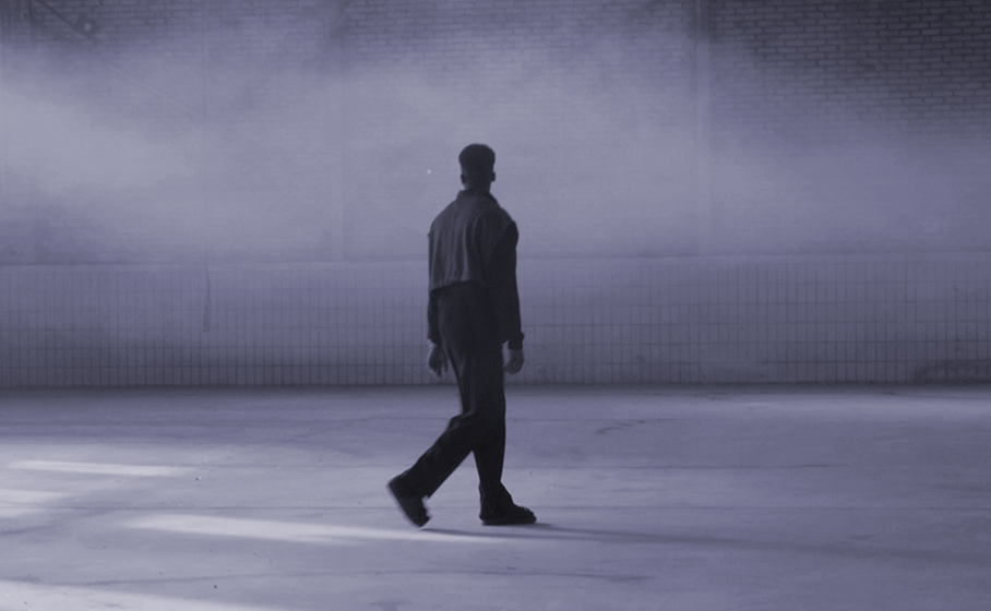 Thumbnail Stories2Tell: A person walks through a warehouse and is surrounded by fog. 
